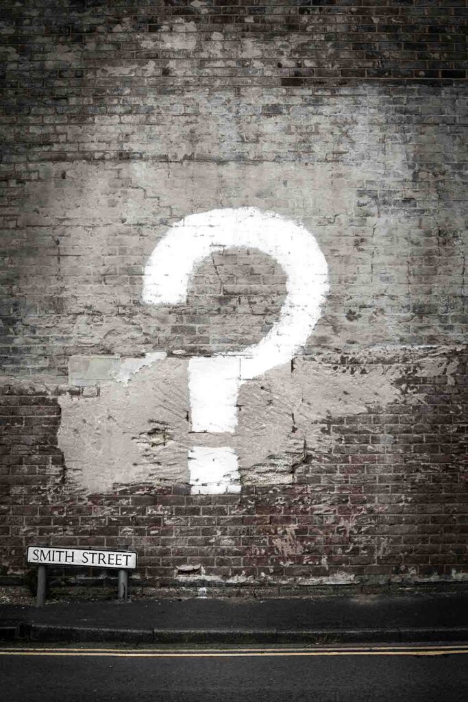 Graphic with large white question mark on gray background